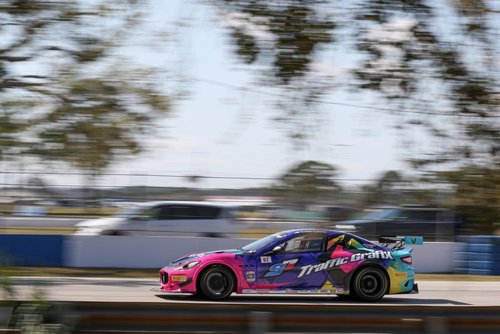 A picture of a multi colored race car